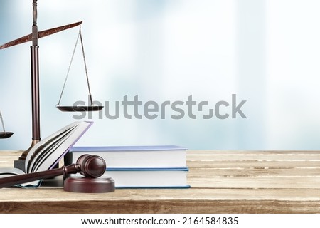 Judge gavel on law books in court, law and justice concept.