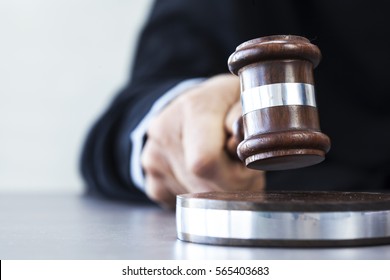 Judge with gavel on table