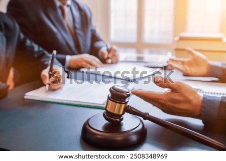 Judge gavel is placed on table in office of lawyer team It is gavel used as symbol of making decision in court case with fairness and ethics. judge gavel is prepared symbolize decision in court case.