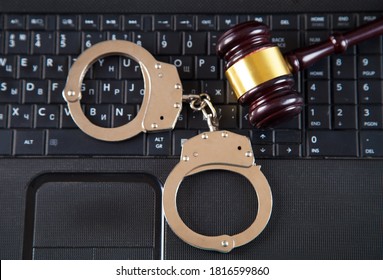 Judge Gavel, Police Handcuffs And Computer Keyboard.