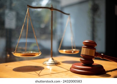 A judge gavel is prepared in the courtroom to be used to give a signal when the verdict is read after the trial is completed. Concept judge gavel is prepared to symbolize the decision in a court case. - Powered by Shutterstock