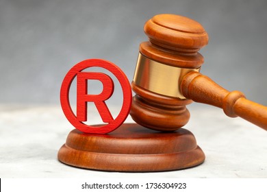 Judge gavel and red trademark sign.