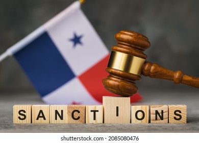 Judge gavel, wooden cubes with the text on the background of the Panama flag, the concept on the theme of the sanctions in Panama - Shutterstock ID 2085080476
