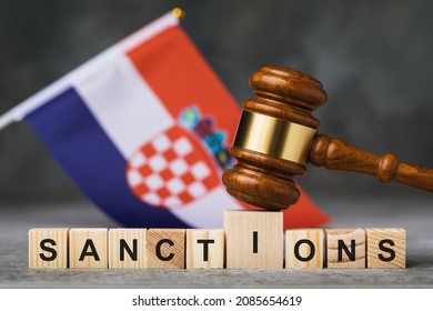 Judge gavel, wooden cubes with the text on the background of the Croatian flag, the concept on the theme of sanctions in Croatia - Shutterstock ID 2085654619