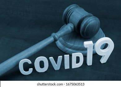 Judge Gavel With Word Covid19. Concept Laws Against Covid-19.