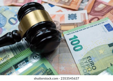 Judge hammer above euro banknotes money. Bribe concept. The law or legel idea