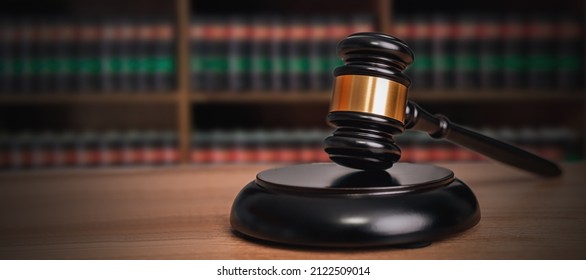 judge hammer with justice or law books in background - Shutterstock ID 2122509014
