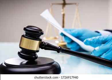 Judge Or Lawyer In Courtroom With Gavel. Court Litigation