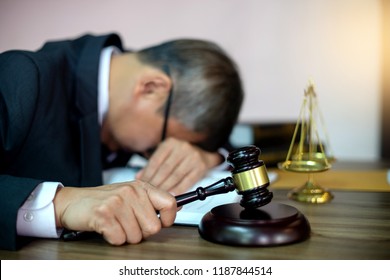 Judge lawyer gavel tired and sleeping in office with  balance  in law firm concept 