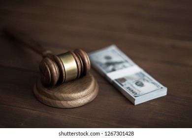 Judge With Money On Table
