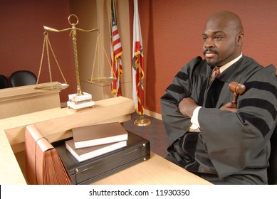 Judge Sitting At The Bench And Listening To Arguments