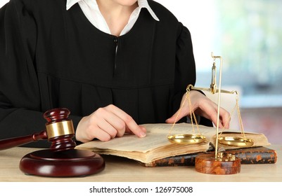 Judge Sitting At Table During Court Hearings On Room Background