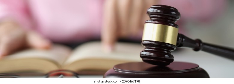 Judge Wooden Gavel Lying On Table In Courthouse Closeup. Judicial Education Concept