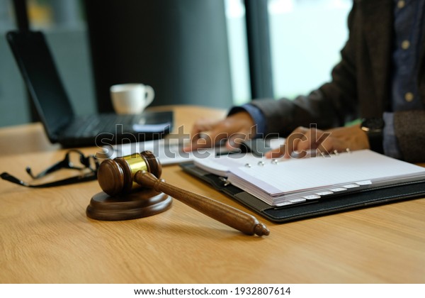 judge working with document.\
legal law gavel at courtroom. lawyer attorney justice at\
court