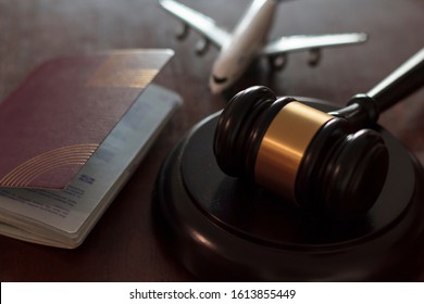 Judge's Gavel, Airplane And Passport. Concept Of International Law, Immigration Law And Citizenship Rights