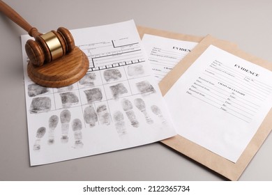 Judges Gavel, Fingerprint Cards And Paper Envelopes To Pack Evidence. Justice Concept, Forensic Fingerprint Analysis.