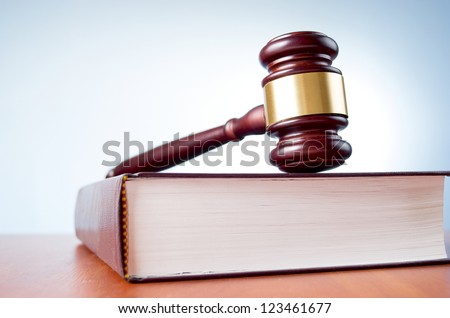 judges gavel and law book on a blue background