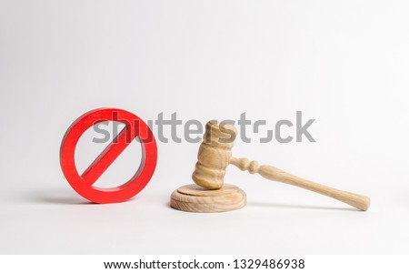 Judge's gavel and NO symbol. The concept of prohibiting and restrictive laws. Prohibitions and criminalization, repression, restriction of freedoms and rights of people and citizens.