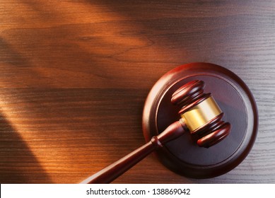 judges gavel on a brown table
