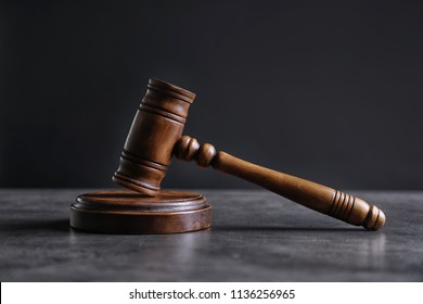 Judge's gavel on grey table. Law concept