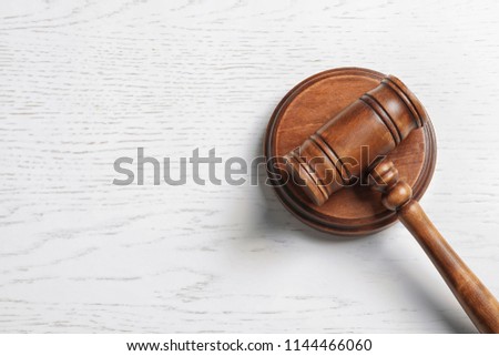 Judge's gavel on light background, top view. Law concept