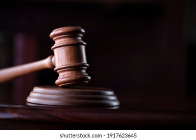 Judges gavel on wooden desk. Law firm concept. - Shutterstock ID 1917623645