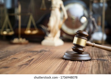 Judges gavel on wooden table. Bokeh background. Law concept.