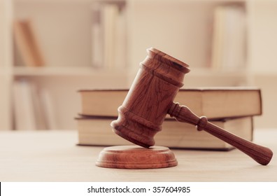 Judges gavel on wooden table with law books. retro style. concept of legal ruling. - Shutterstock ID 357604985