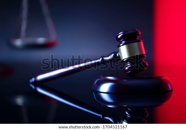 Judge's gavel, scales, statue of
justice. Red light. Law and order social justice 
concept.