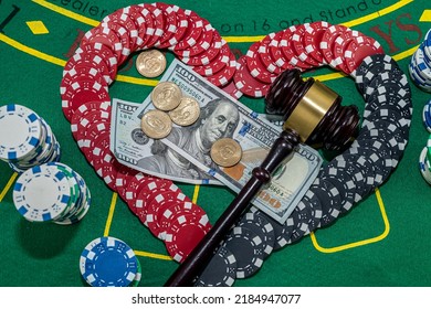 Judge's Gavel Stands Next To Playing Cards Poker Chips On Green Table. Responsibility For The Underground Casino. Illegal Gambling. Isolated