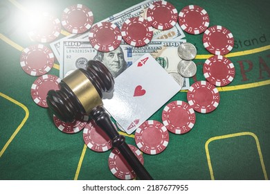 Judge's Gavel Stands Next To Playing Cards Poker Chips On Green Table. Responsibility For The Underground Casino. Illegal Gambling. Isolated