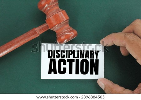 judge's gavel and white paper with the word disciplinary action. the concept of disciplinary action. disciplined concept. attitude concept