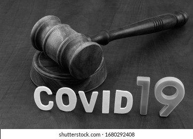 Judge's Gavel With Word Covid19. Laws Against Coronavirus Covid-19.