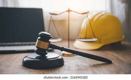 Judge's hammer and helmet Law and Justice about labor law concept Construction law. - Shutterstock ID 2165943183