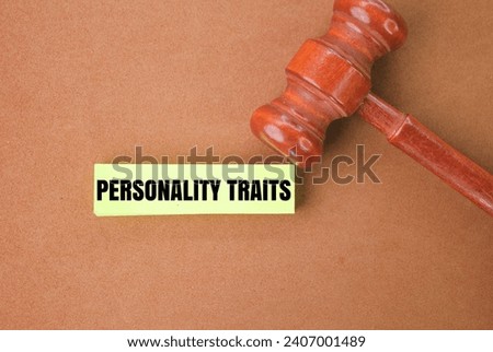 judge's hammer with the word personality traits. the concept of a person's behavior or attitude