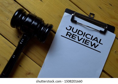 Judicial Review Document Form And Black Judges Gavel On Wooden Desk. Law Concept