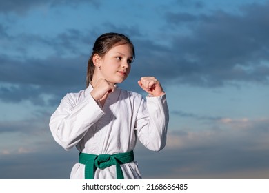 Judo Girl In Kimono On Sky Background