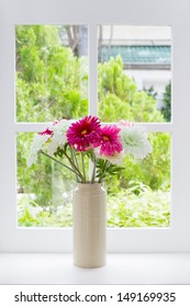 Jug Of Fresh Summer Flowers On A Window Sill