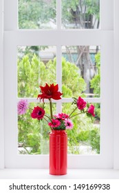 Jug Of Fresh Summer Flowers On A Window Sill