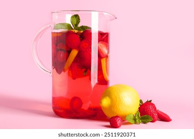 Jug of infused water with strawberry and lemon on pink background - Powered by Shutterstock