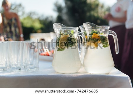 Similar – Freunde am Tisch mit frischer Limonade, die Spaß macht.