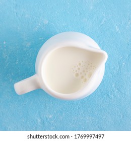 
Jug Milk On A Blue Background, Top View.