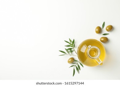 Jug With Olive Oil, Olives And Leaves On White Background, Top View