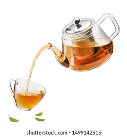 Jug pouring hot tea into glass cup with green tea leaves in the air, Healthy products by organic natural ingredients concept, Empty space in studio shot isolated on white background - Powered by Shutterstock