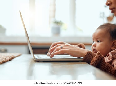 Juggling Responsibilities Like A Boss. Cropped Shot Of An Unrecognizable Young Woman Working At Home With Her Newborn Baby Sitting On Her Laptop.