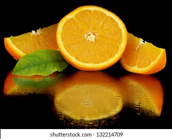 Juice Orange Fruit On A Black Background With Water Drops