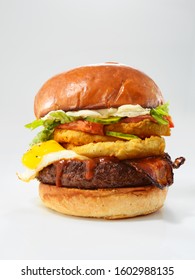 Juicy Bacon Cheese Burger With Ann Egg On White Background