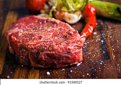 Juicy  Beef Steak With Pepper On A Butcher Block