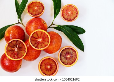 Juicy Blood Oranges on the white background. Blood oranges isolated. Top view, flat lay