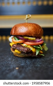Juicy burger close-up. Appetizing burger. - Shutterstock ID 1958587906